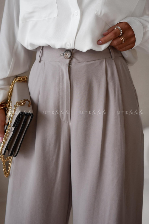 Spodnie o prostym kroju beżowe Krakom